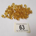 55 Swarovski gold teardrop crystals.