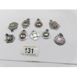9 silver watch fobs.