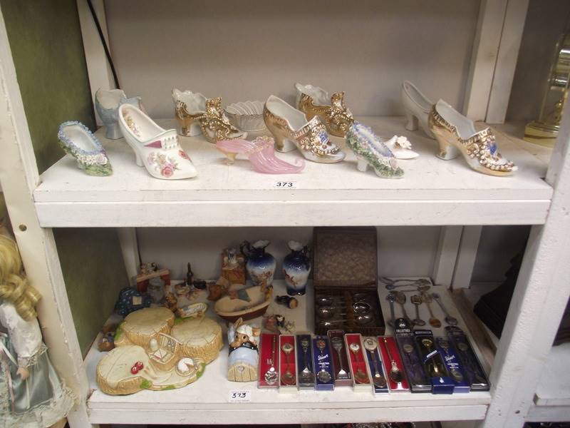 2 shelves of collectors shoes, spoons, 2 items of Pendelfin etc.