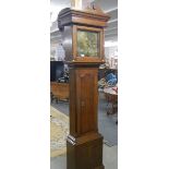 An oak square brass dial Grandfather clock.