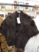 A stylist fur cape by The Fur Room, Rackhams, ideal for wedding cape. (in very good condition).