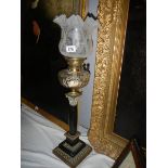 A black marble Corinthian column oil lamp with cut glass font.