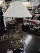 A gilded spelter urn table lamp (wiring a/f).