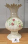 A belleek vase with applied rose decoration, 20 cm tall.