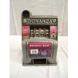A vintage miniature Toy Bonanza Bank 1 arm bandit with metal front. i.w.o.