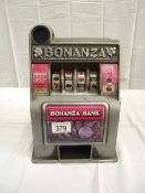 A vintage miniature Toy Bonanza Bank 1 arm bandit with metal front. i.w.o.