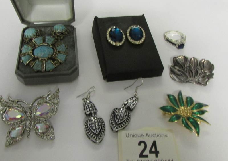 4 brooches, 3 pairs of earrings and a ring.