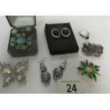 4 brooches, 3 pairs of earrings and a ring.