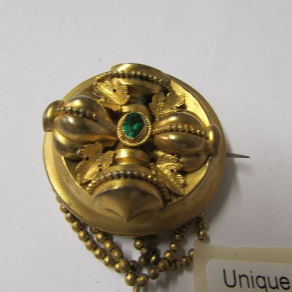 A Victorian brooch set with a green stone having tassel drops in yellow metal. - Image 2 of 3