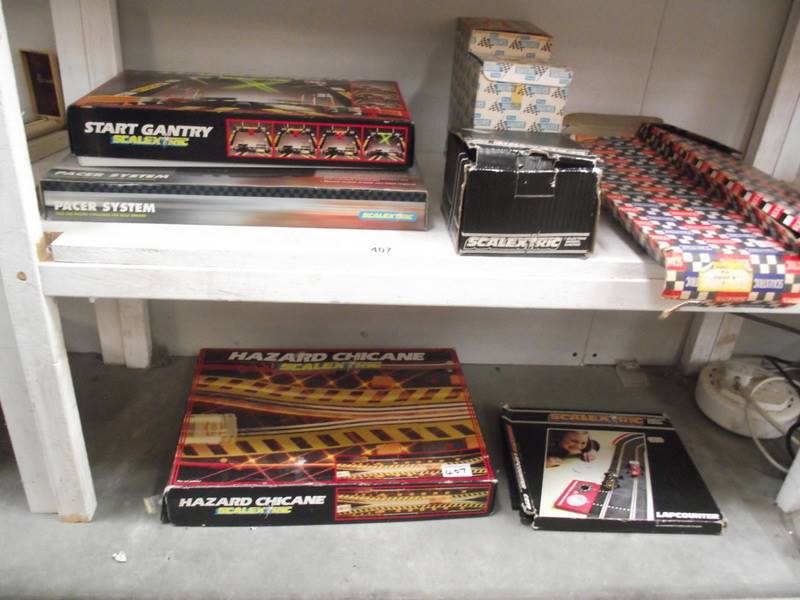 A quantity of boxed Scalextric accessories including A/202 racing pit A/201 event board and hut,