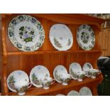 An 18 piece tea set and 2 Booth's plates.