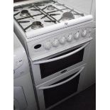 A Belling gas cooker with grill and 4 hob plates.
