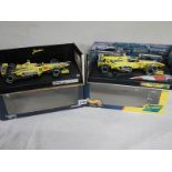 Two boxed Jordan racing cars, E310 and 199.