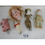 5 interesting old dolls and parts including Indian doll with moveable arms.