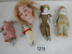 5 interesting old dolls and parts including Indian doll with moveable arms.