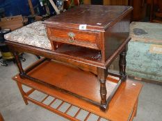 A telephone seat and a coffee table.