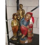 3 1930's painted plaster figures including whistling boy and a painted wooden figure of a golfer