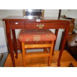 A mahogany hall table and a stool.