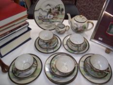 A Japanese Ritz china hand painted teaset with geisha in base of cups (missing 1 cup in set)