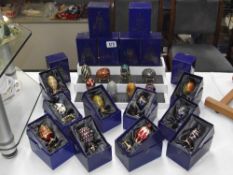 A large collection of Atlas edition decorative Faberge style eggs