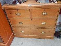 An old pine 2 over 2 chest of drawers.