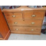 An old pine 2 over 2 chest of drawers.