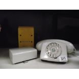 A vintage dial telephone with bell box and BT detector