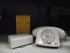 A vintage dial telephone with bell box and BT detector