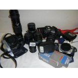 A mixed lot of camera's, lenses and accessories including Canon EOS 600, Yashica TL Electro etc.
