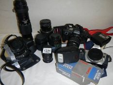 A mixed lot of camera's, lenses and accessories including Canon EOS 600, Yashica TL Electro etc.
