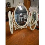 A triple dressing table mirror.