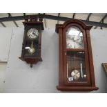 A 31 day wall clock and 1 other