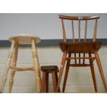 An Ercol kitchen chair, a stool and an early 20th century stool.