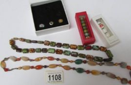 2 natural stone necklaces and a quantity of 'Love Links' beads.
