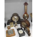 A 1930s oak mantel clock and other closk and barometers