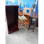 An old gateleg table, a stool, a cabinet and a mahogany bookcase.