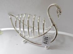A large silver plated swan shaped toast rack.