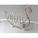 A large silver plated swan shaped toast rack.