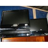 2 flat screen television sets and a Panasonic recorder.