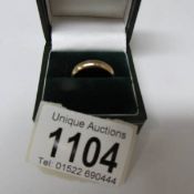 A 9ct gold wedding ring, size M. 4 grams.