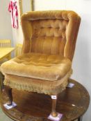 A deep buttoned draylon nursing chair