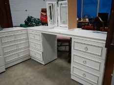 A white dressing table and 3 drawer chest.