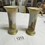 A pair of Royal Worcester vases hand painted with pheasants, signed H Stinton, year mark 1918.