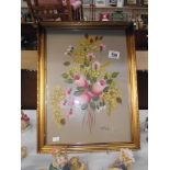 A gilt framed oil on board of Roses signed Rossi