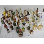 Approximately 50 miniature bottles of wine and spirits.