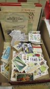 A mixed lot of cigarette cards, loose and in albums.