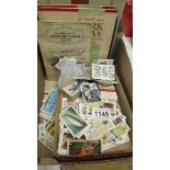 A mixed lot of cigarette cards, loose and in albums.