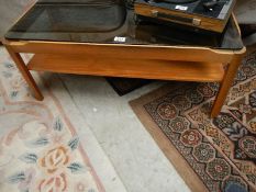 A glass topped side table.