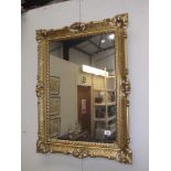 An ornate gilded framed mirror