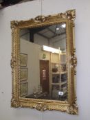 An ornate gilded framed mirror